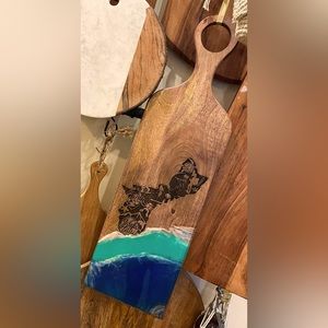 Custom cutting board with Guam engraved.